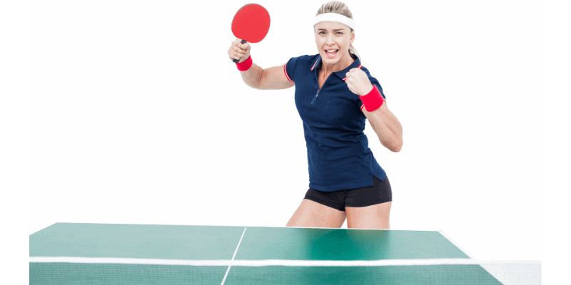 Confident woman celebrating during a table tennis match, showcasing the emotional and fitness benefits of playing table tennis.