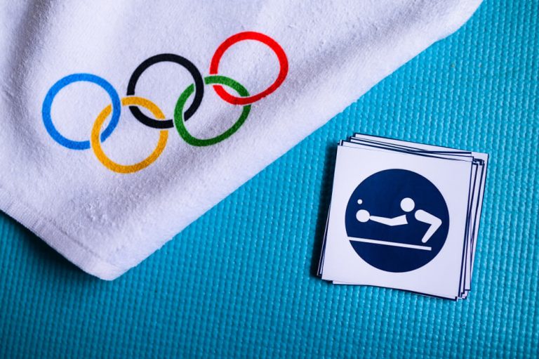 table tennis olympics history featured image a towel with circles of olympic games