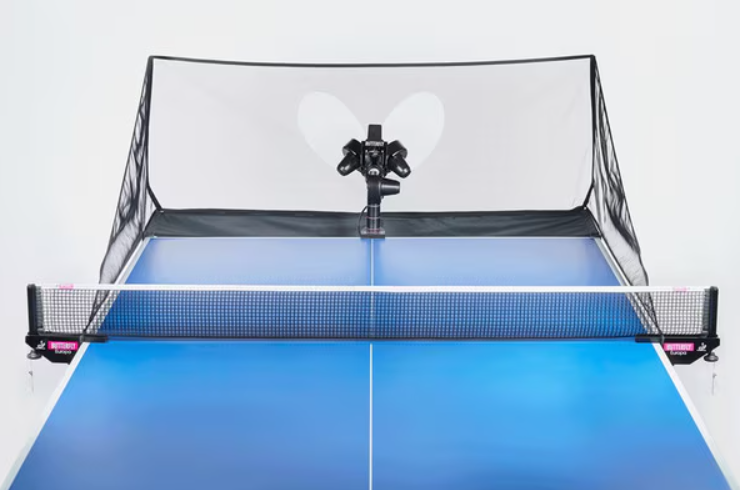 Front view of a table tennis robot with ball net on a blue table, designed for solo training and precision practice.
