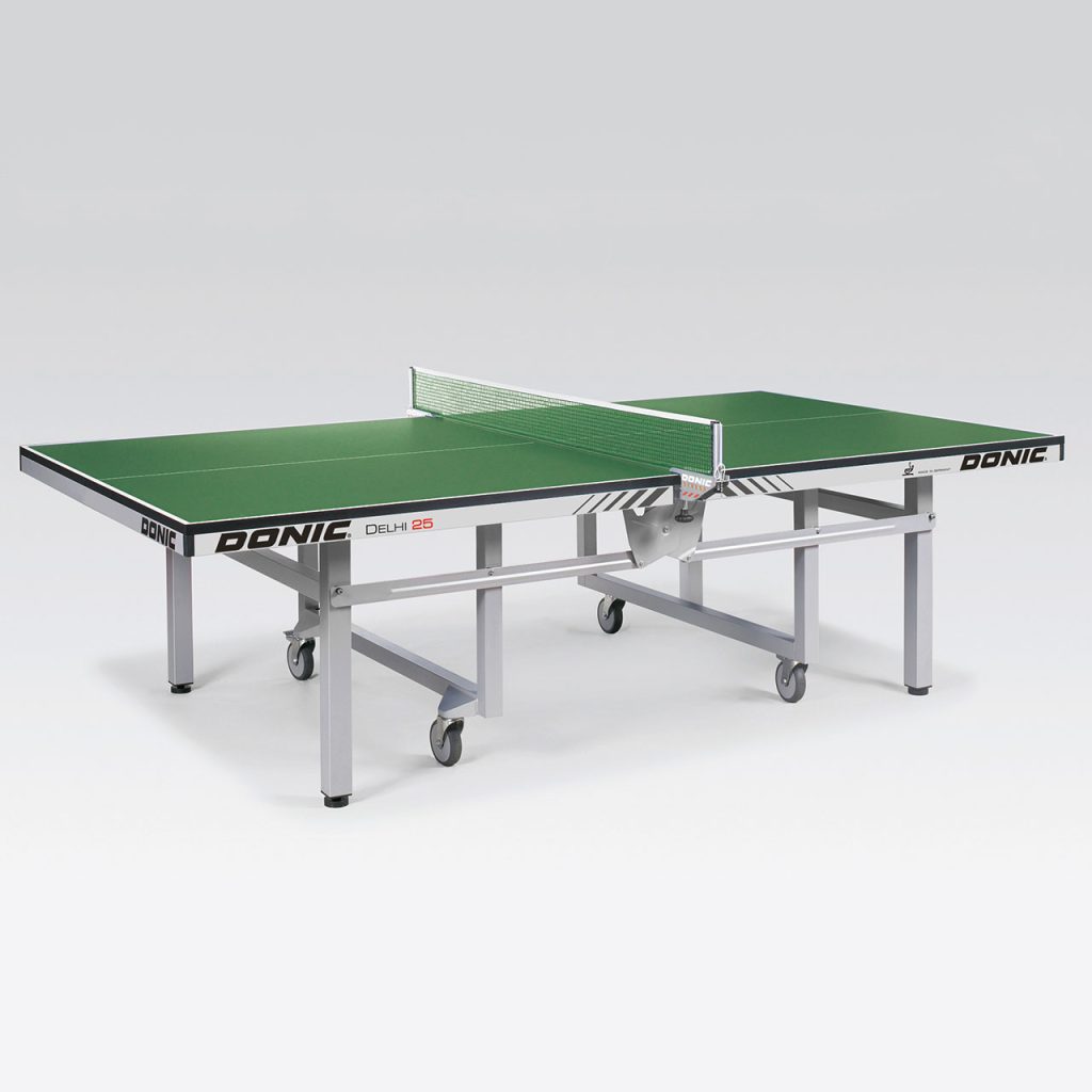 Green Donic Delhi 25 table tennis table with sturdy metal frame, wheels, and net, designed for professional-level play.